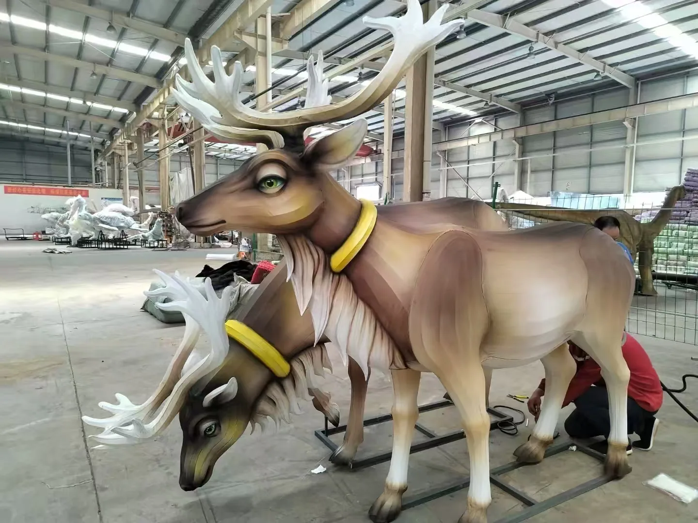 Detailed deer lantern pair inspected in the workshop