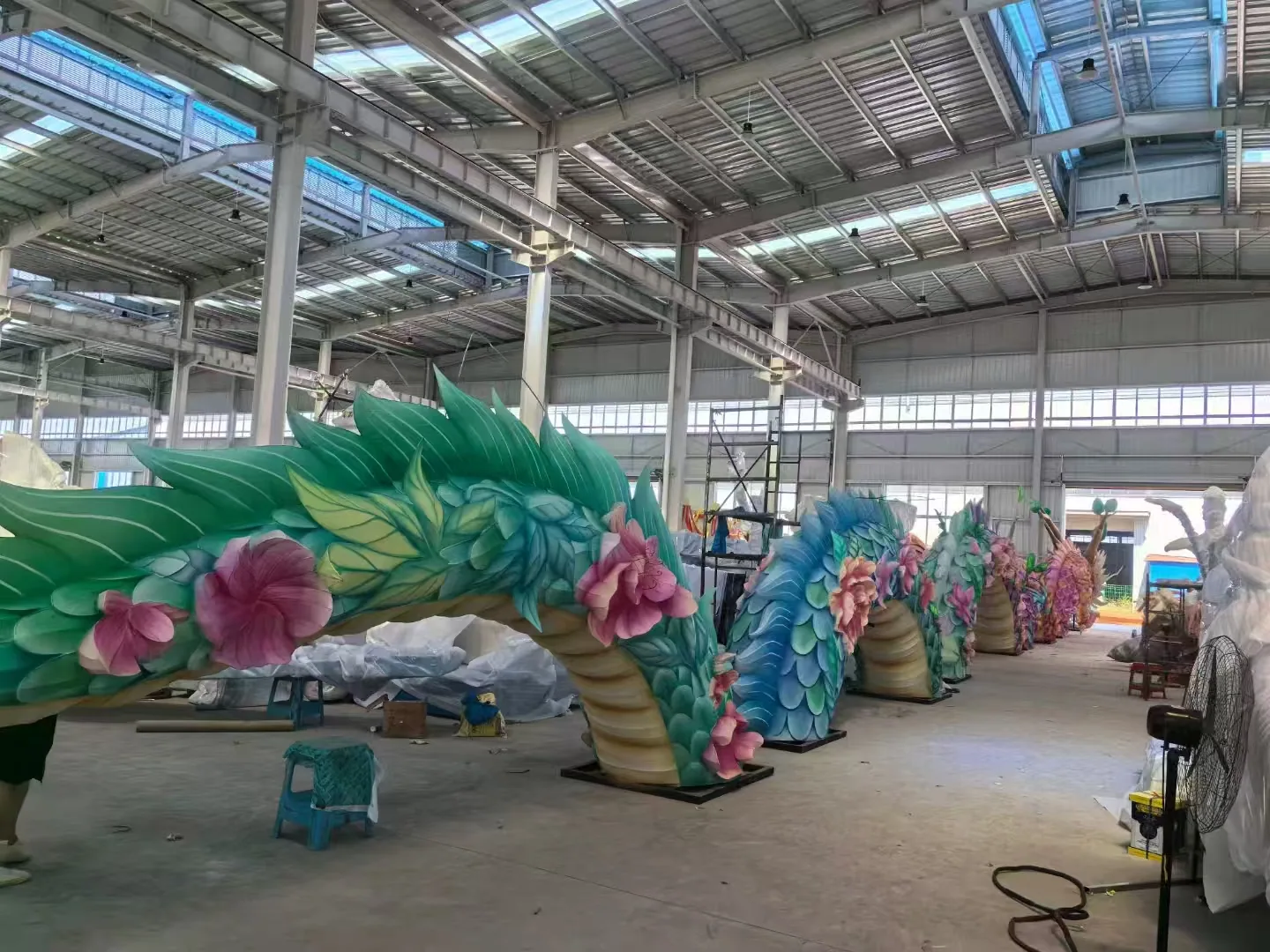 Long floral dragon body modules arranged in the workshop