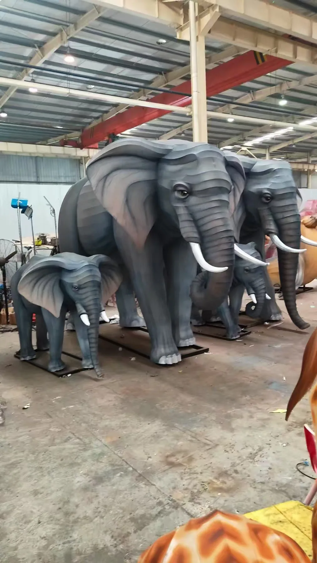 Elephant family lanterns before final lighting test inside the workshop