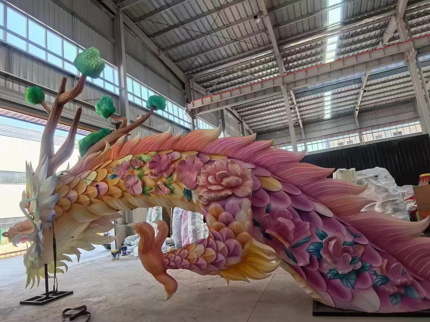 Floral dragon lantern profile with colorful scales inside the workshop