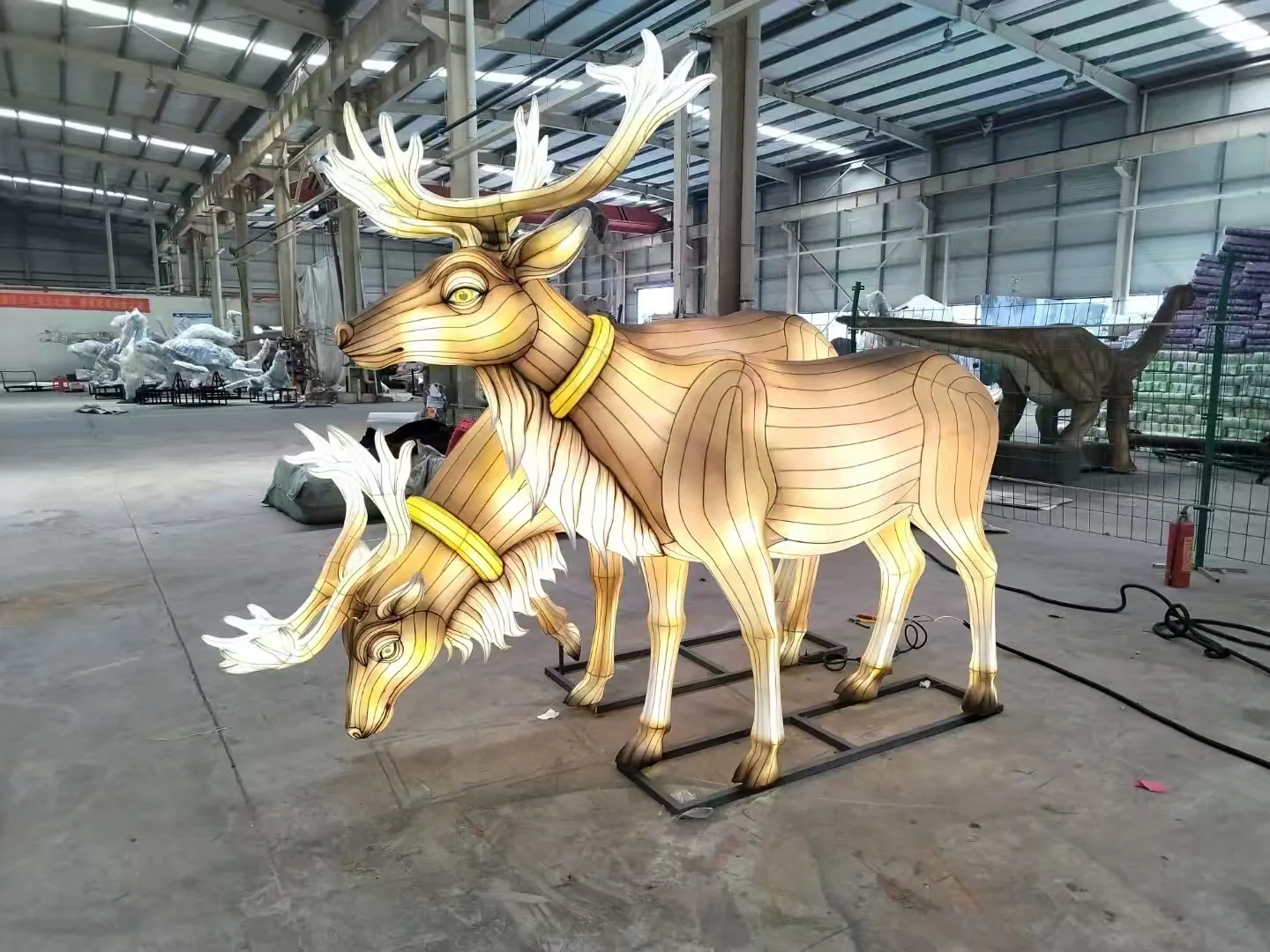 Illuminated deer pair lanterns tested inside the workshop