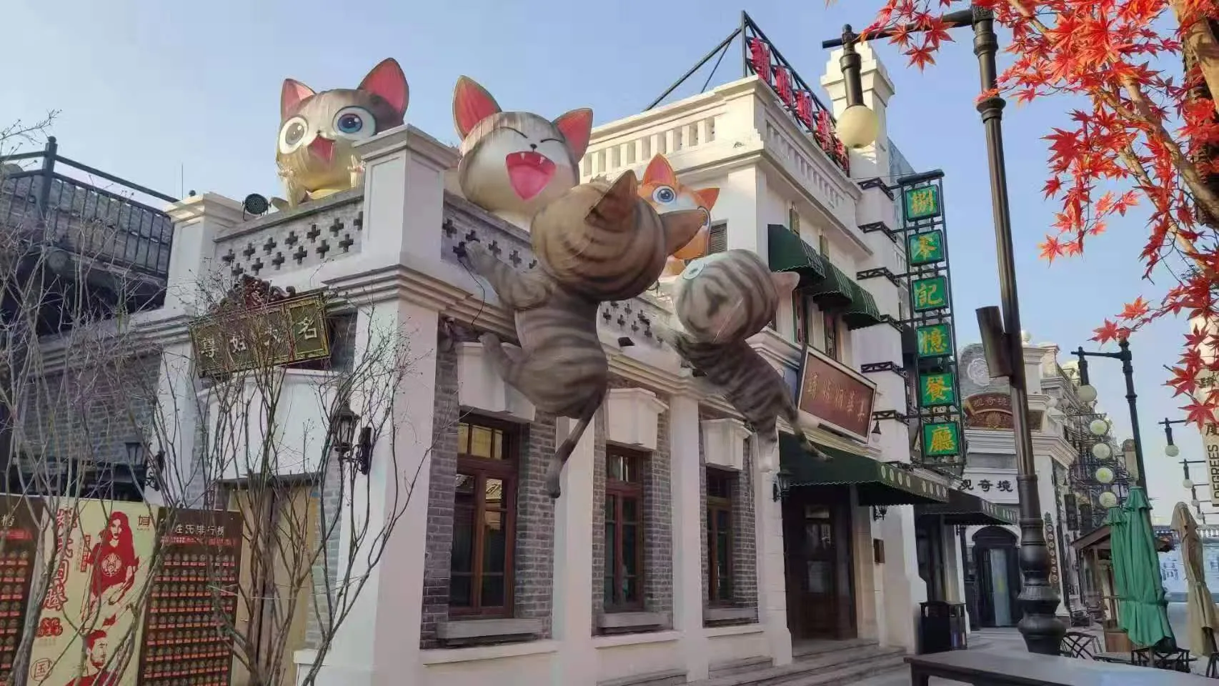 Daytime street facade with flying Miss Cat character lanterns