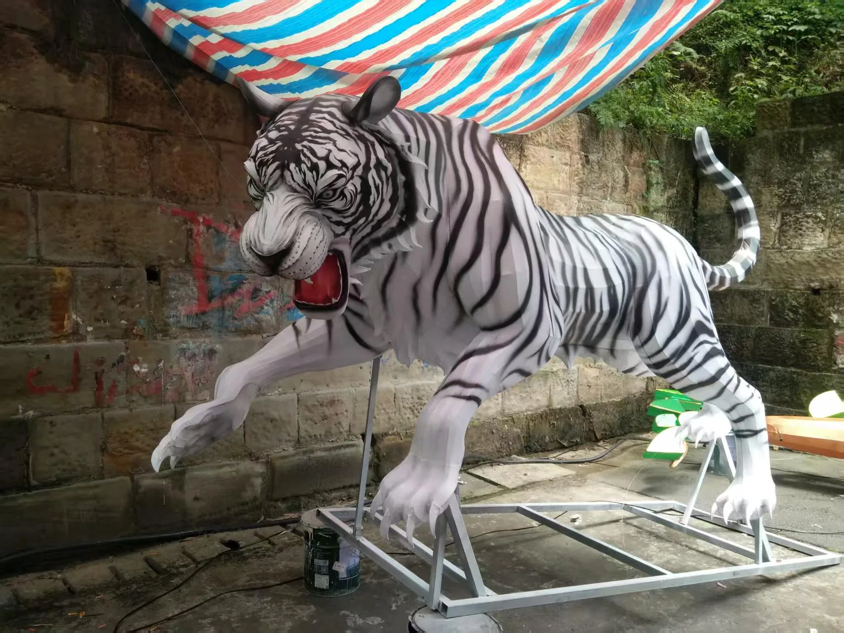 White tiger lantern sculpture during workshop production