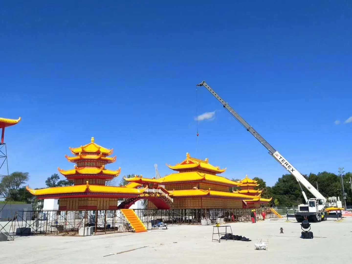 Large illuminated palace structure under construction at the Montreal carnival site