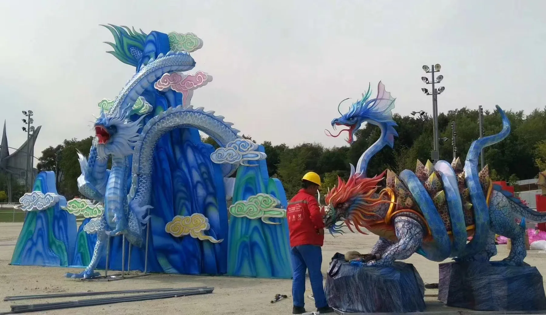 Dragon and mountain lantern scenes being assembled at the Montreal site