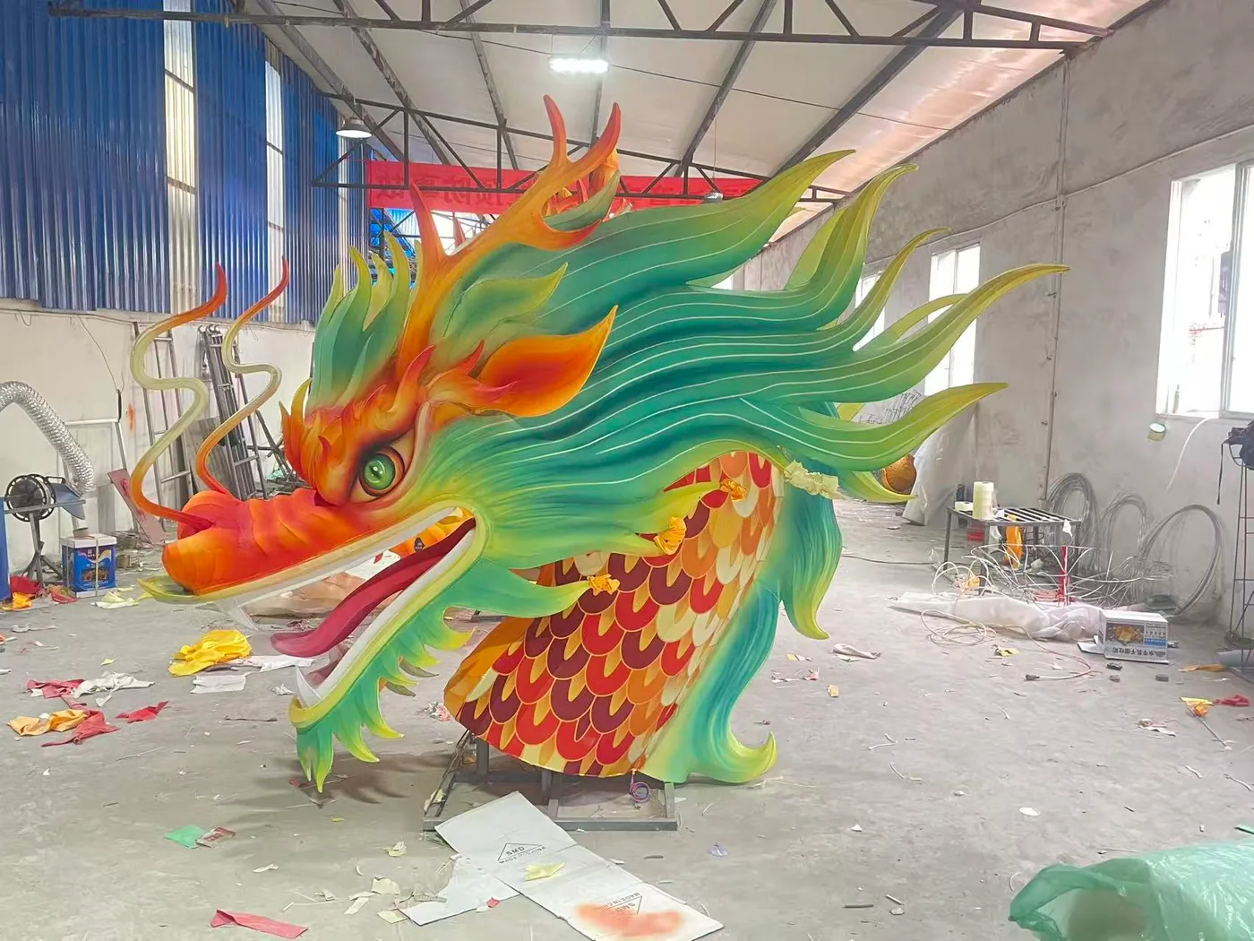 Colorful dragon lantern head being finished in the factory