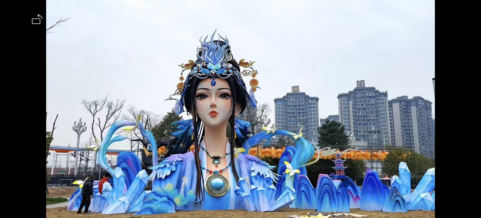 Large blue goddess festival lantern installed on site by Shilong Lantern Art